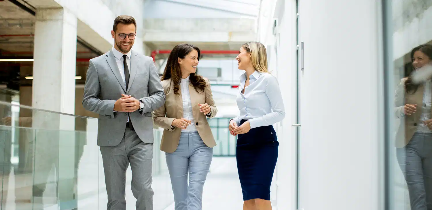 startup team have a discussion in office corridor